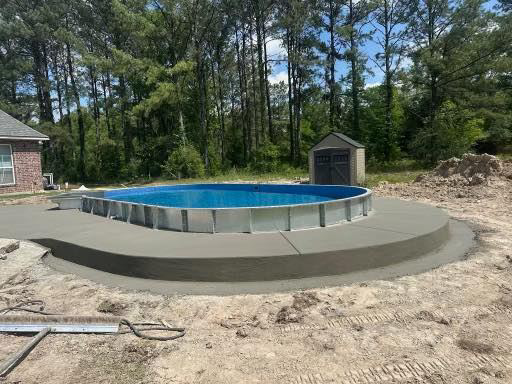 New concrete coping installed around an above-ground pool by Comeaux Home Services in Baton Rouge, LA.