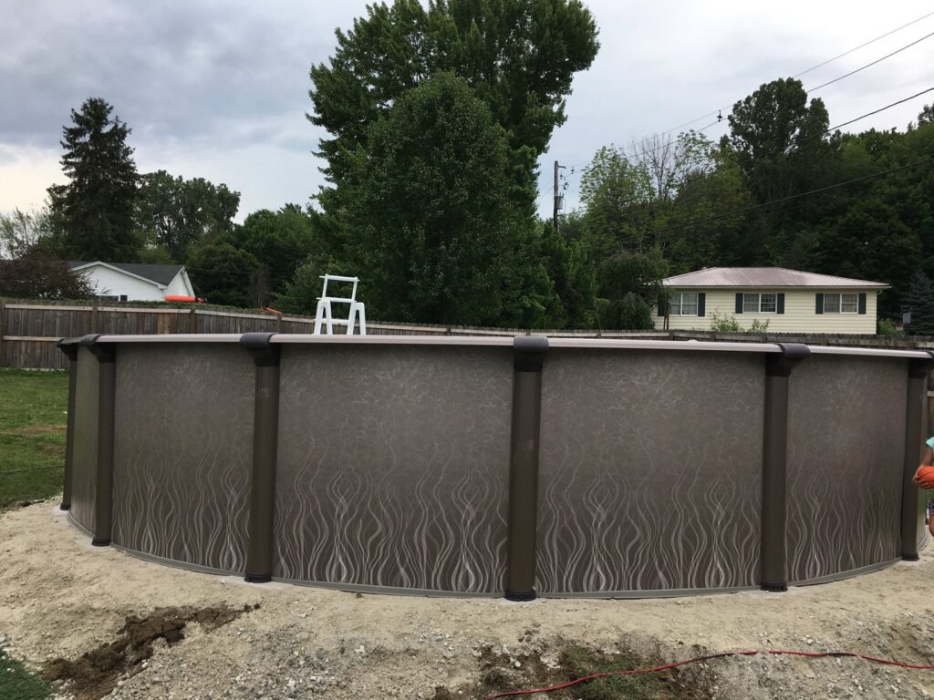 An above-ground pool installation in progress, showing the structure being built by My Pool Guys of Erie, PA.