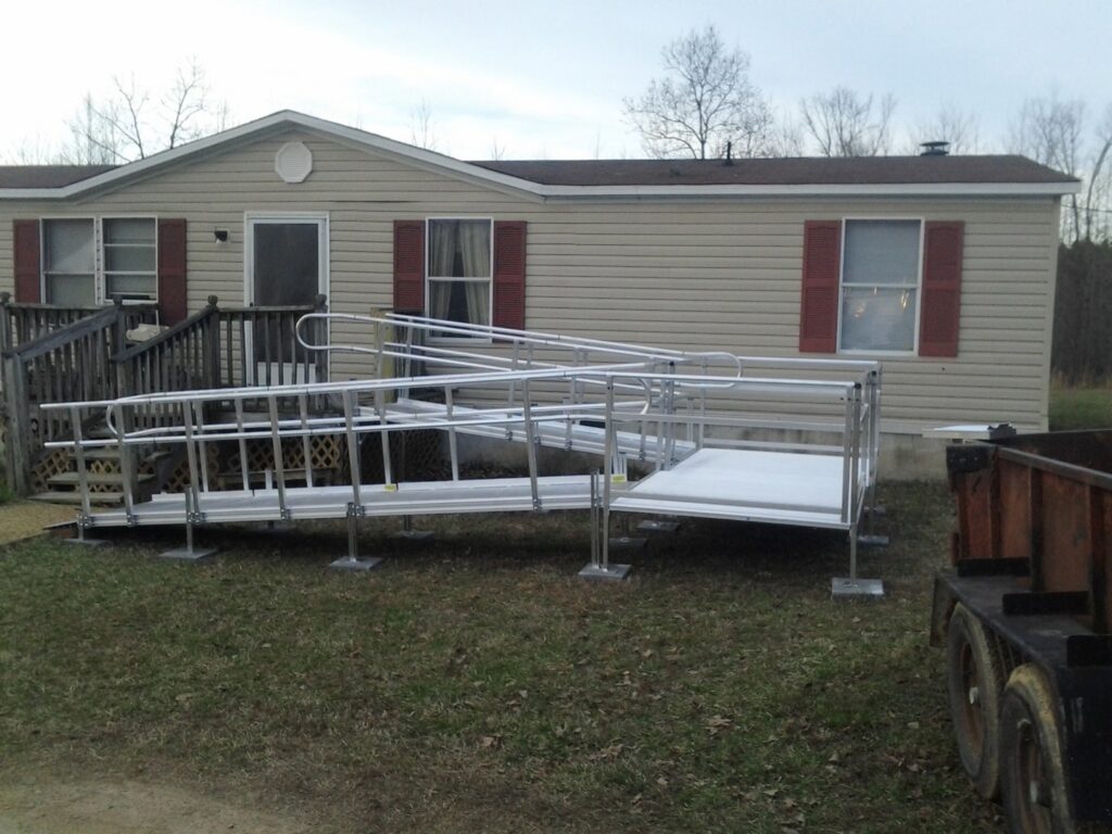 A new metal accessibility ramp installed outside a mobile home by The Home Pros in Virginia Beach, VA