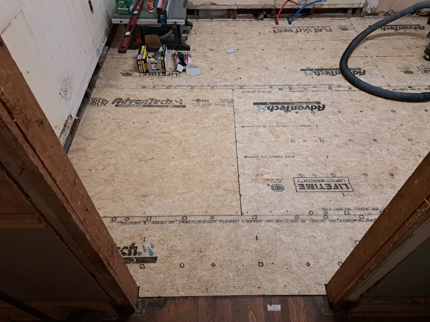 View of newly installed Advantech subfloor panels from a doorway by Vest Home Services LLC in Greenville, SC.
