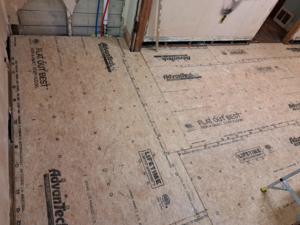 New Advantech subfloor panels installed in a room during renovation by Vest Home Services LLC in Greenville, SC.