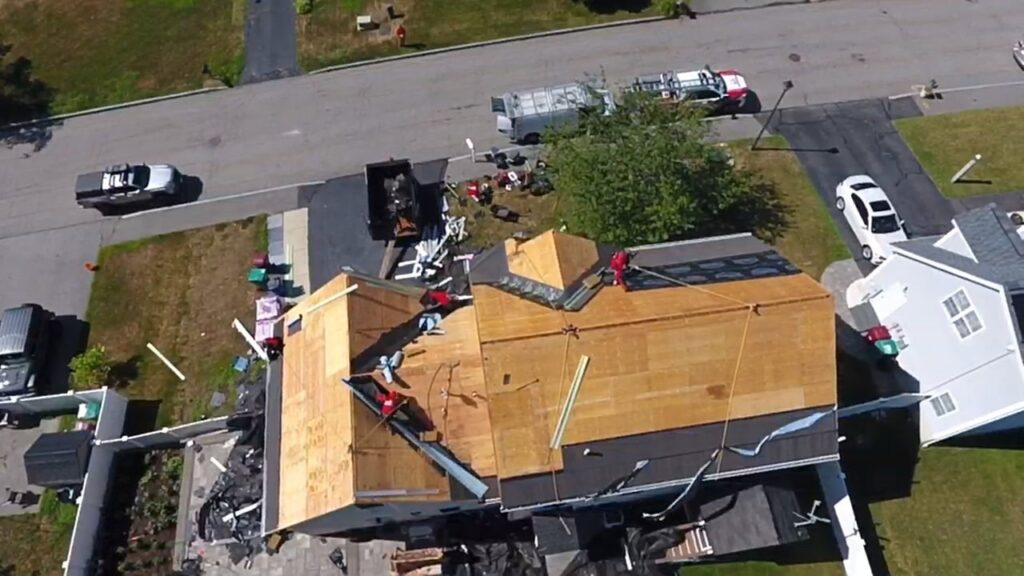 An aerial view of a roof being stripped and new underlayment installed by Joe's Roofing in Strongsville, OH.