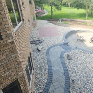 Aerial view of a completed paver walkway and patio installation by Great Plains Remodeling and Handyman Services in Mitchell, SD.