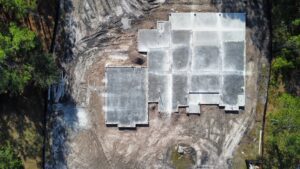 An aerial view of large concrete foundation slabs poured on a construction site by Bayside Concrete & Construction in Tampa, FL