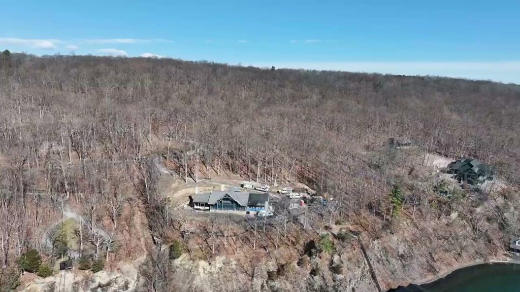 An aerial view of a house under construction on a hillside by AB Insulation in Palmyra, NY.