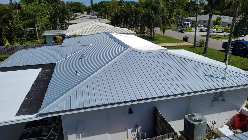 An aerial view showcasing a recently completed metal roof installation by Florida Roof & Building Services LLC in Ellenton, FL.
