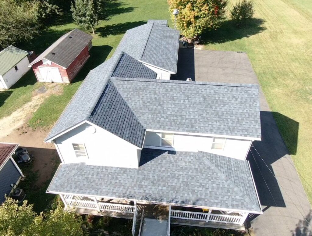 An aerial view showcasing a newly installed roof on a residential property by M&V Home Solutions Inc in Elgin, IL