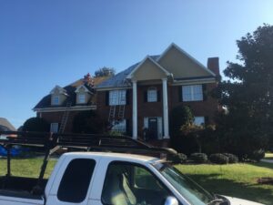 An aerial view of a home with a new roof and skylights installed by Innovative Roofing & Siding Inc in Knoxville, TN.