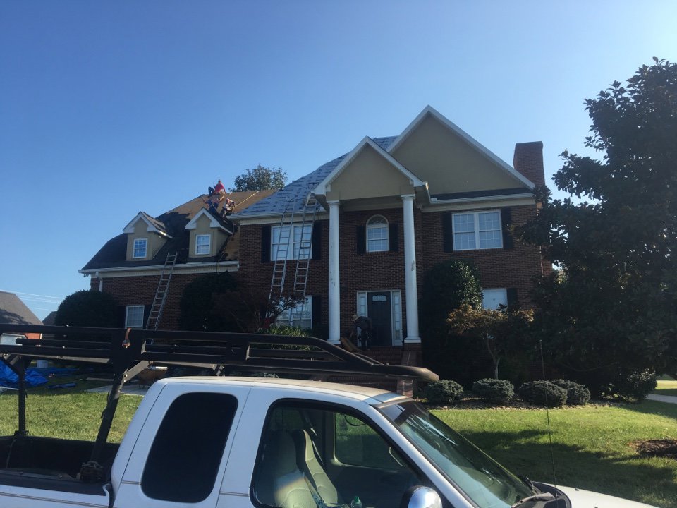 An aerial view of a home with a new roof and skylights installed by Innovative Roofing & Siding Inc in Knoxville, TN.
