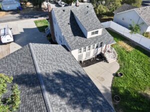An aerial view of a newly installed roof on a residential property by Proline Roofing in Shipshewana, IN.