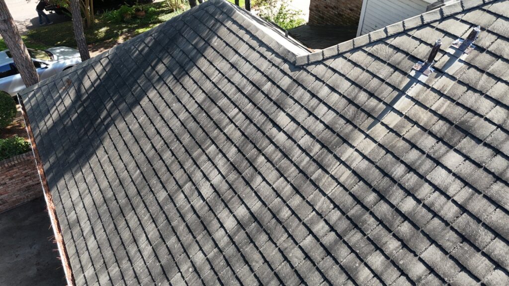 An aerial view of a residential roof, possibly for inspection or repair, by Coyote Restoration in North Richland Hills, TX.
