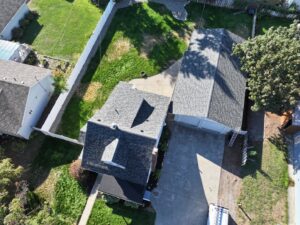 An aerial view of two residential houses with newly installed roofs by Proline Roofing in Shipshewana, IN.