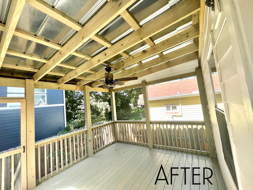 An 'AFTER' view of a newly constructed covered deck with exposed wooden beams and a metal roof by Music City Home Experience in Nashville, TN.
