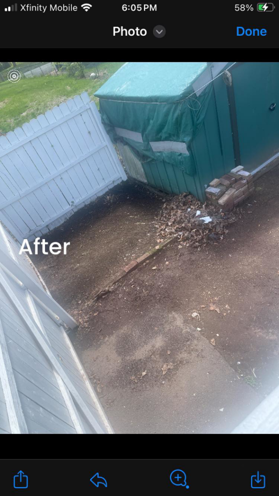 An 'after' photo showing a clean backyard following junk removal services by Happy Hauling & Junk Removal in Hartford, CT.
