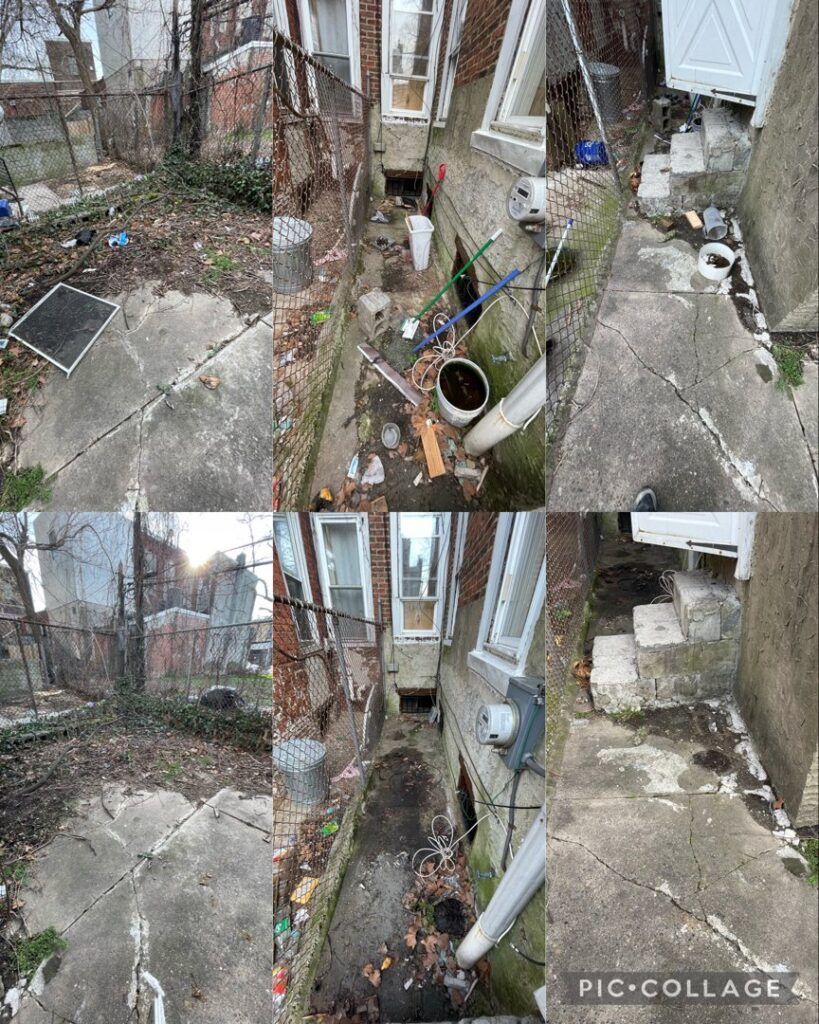 A narrow alleyway filled with trash, debris, and overgrown weeds, showing a cleanup job by JPC Junk Removal & Demolition in Philadelphia, PA.
