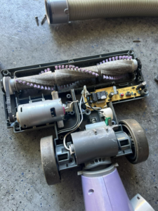 A disassembled vacuum cleaner showing internal components, ready for appliance repair by Handyman Service's in North Las Vegas, NV.