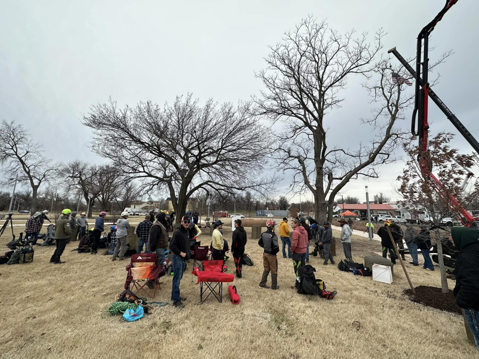 A group of arborists and tree workers with equipment at a job site for Firestorm Tree Specialists in Oklahoma City, OK.