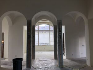 Arched hallway with drywall finishing and painted walls by D&G Drywall in Fort Lauderdale, FL