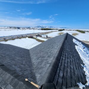 Asphalt shingle roof repair or installation with a hammer visible by RC Contracting in Chesterfield, MO.