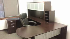 A fully assembled L-shaped office desk with hutch and filing cabinet by DCI - Deason Contracting & Installations in St. Louis, MO