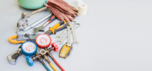 An assortment of handyman tools, including HVAC gauges, wrenches, and pliers, by Advanced Mechanical Contractors, Inc. in Nashville, TN.