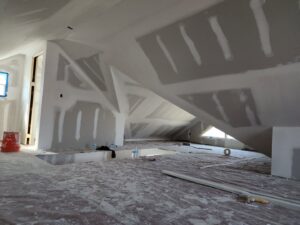 Attic space with extensive drywall taping and mudding in progress by FG Drywall, Finishing and Painting in Champaign, IL.