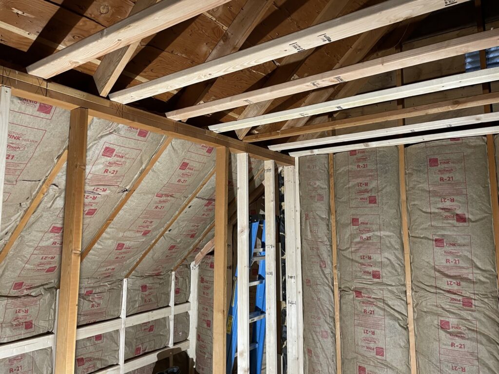 Attic framing and insulation work in progress by Denver House Repair in Lakewood, CO.