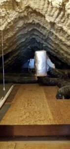 Attic space with extensive spray foam insulation applied to the roofline and around ductwork by Spray Foam Solutions Of Erie in Erie, PA.