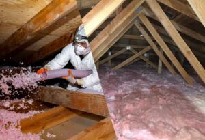 A split image showing a technician installing blown-in insulation in an attic and the completed, fully insulated attic space by Northwest Crawl Space Services in Kent, WA.