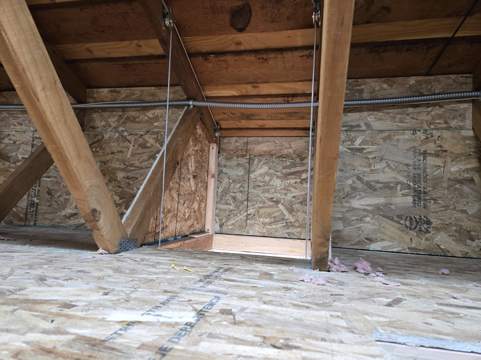 Structural work and cable system for an attic lift installation by Hands On Repair in Renton, WA.