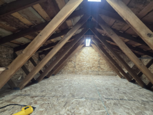 Newly installed plywood flooring in an attic space by Hands On Repair in Renton, WA.