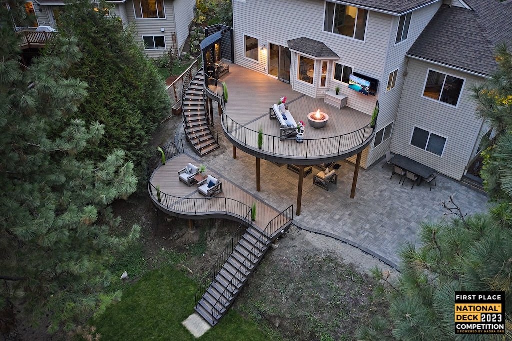 An aerial view of an award-winning multi-level deck with curved design and spiral stairs, built by Ridgeline Decks in Spokane, WA.