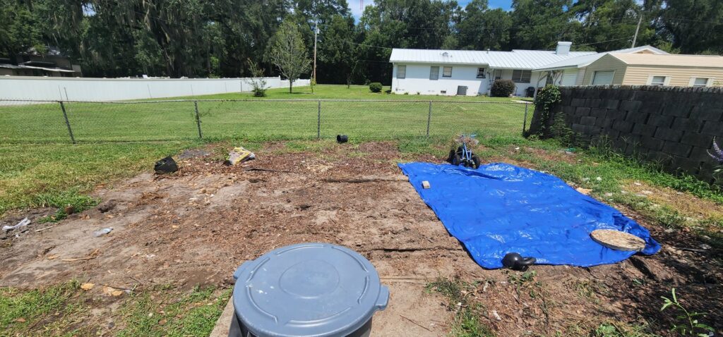 A backyard cleared of debris, showing the successful completion of a junk removal job by Jax Junk Squad in Jacksonville, FL.