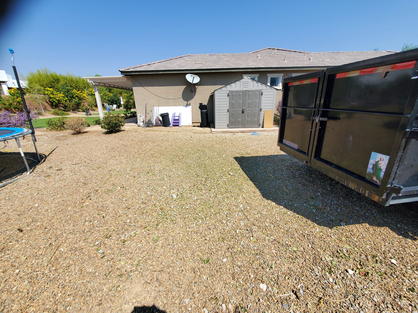 A residential backyard cleared of debris and yard waste after a successful junk removal service by V.S.C Junk Removal Services in Las Vegas, NV.