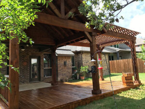 A beautiful backyard deck and patio cover installation by Tin Star Fencing in Fort Worth, TX