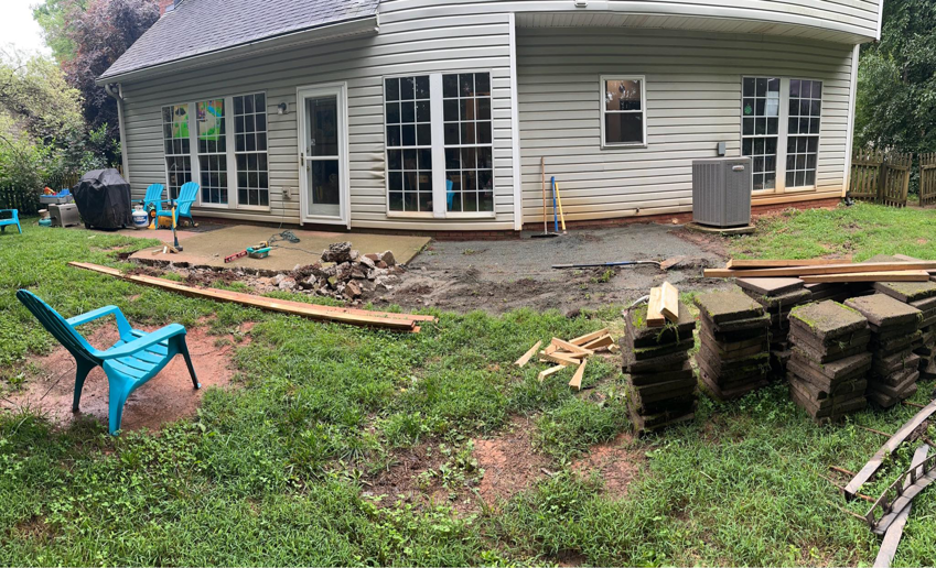 A backyard patio construction project in progress by Swift Remodeling South in Charlotte, NC.