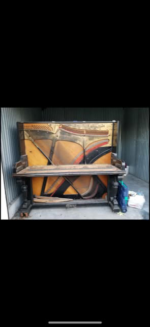 Backyard area with a shed and cleared ground, showing site prep by Port City Remove and Improve in Wilmington, NC