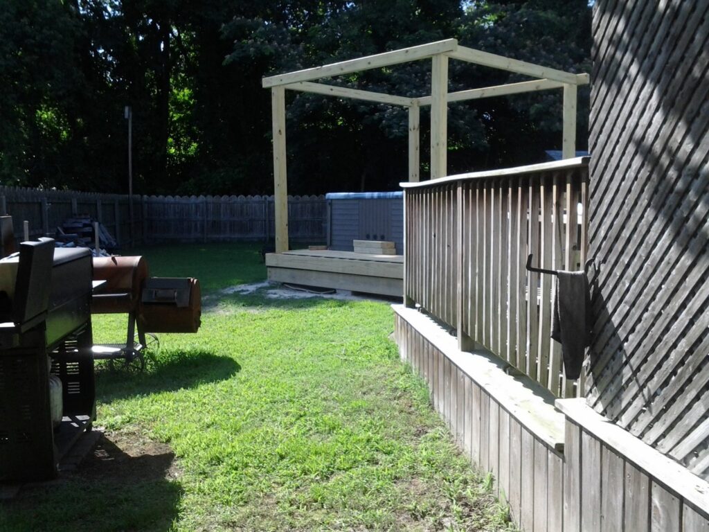 Wooden framing for a new backyard structure or deck being built by The Home Pros in Virginia Beach, VA