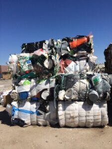 Large stacks of baled plastic and mixed materials for recycling or disposal by A Track-Out Solution in Las Vegas, NV.