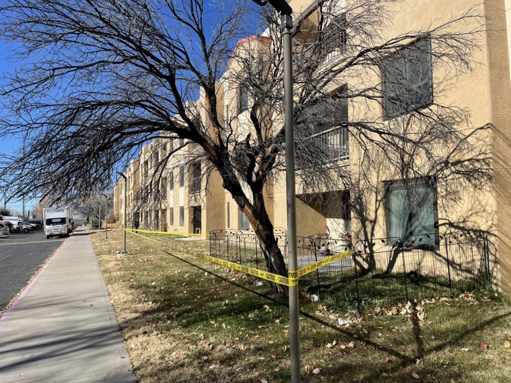 A bare tree with caution tape around its base, prepared for removal or heavy pruning by Green Peak Landscaping LLC in Kaysville, UT.