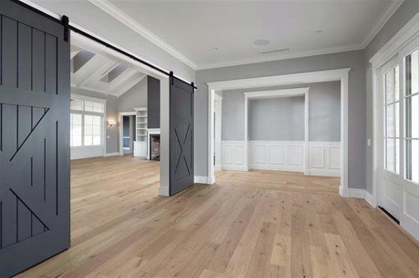 Modern interior with barn door installation and trim work by Mountain Door and Trim in Phoenix, AZ.