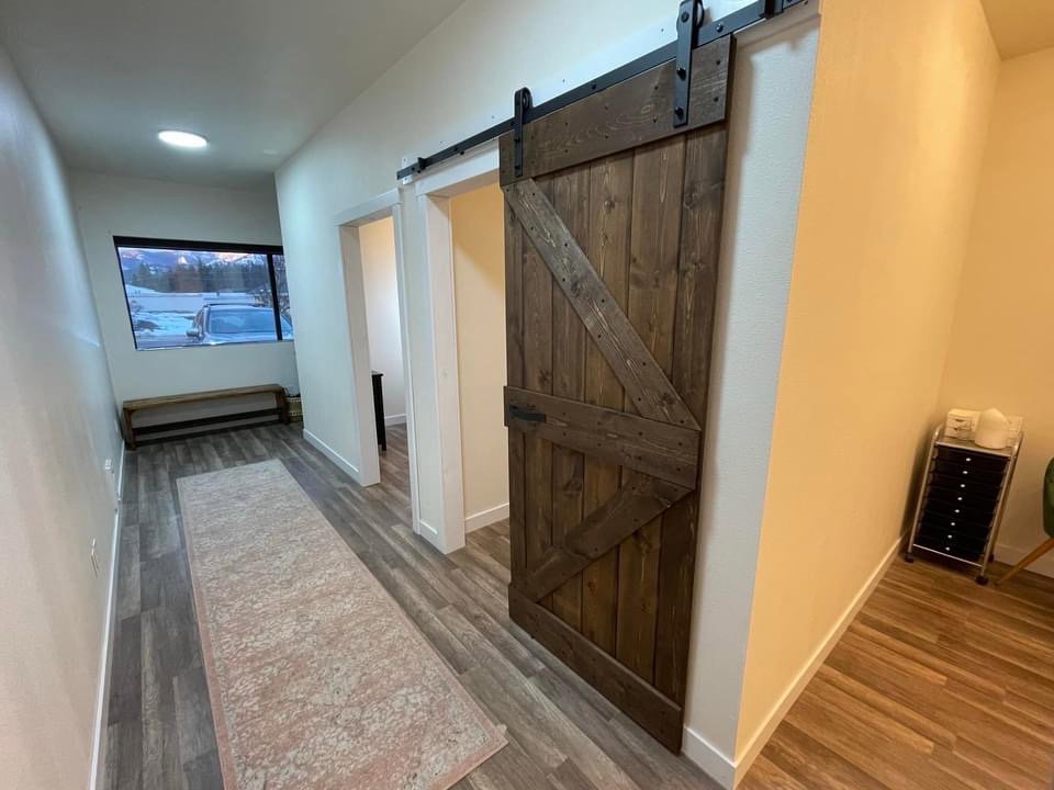 Interior barn door installation in a hallway by Panhandle Contracting Co. in Rathdrum, ID