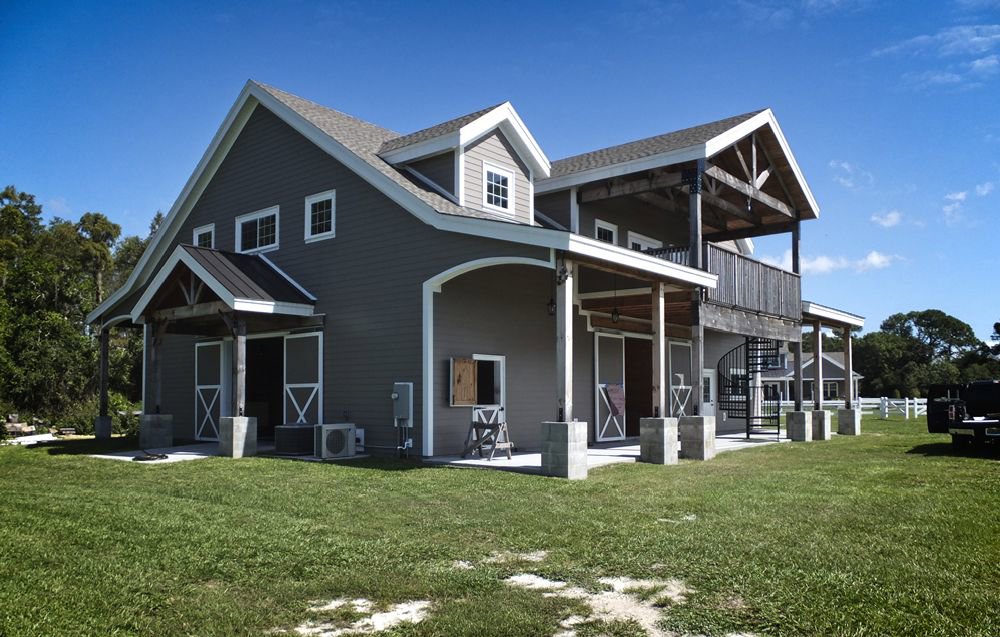 Exterior view of a large barn-style building by Charter Bay Home Builders in Tampa, FL