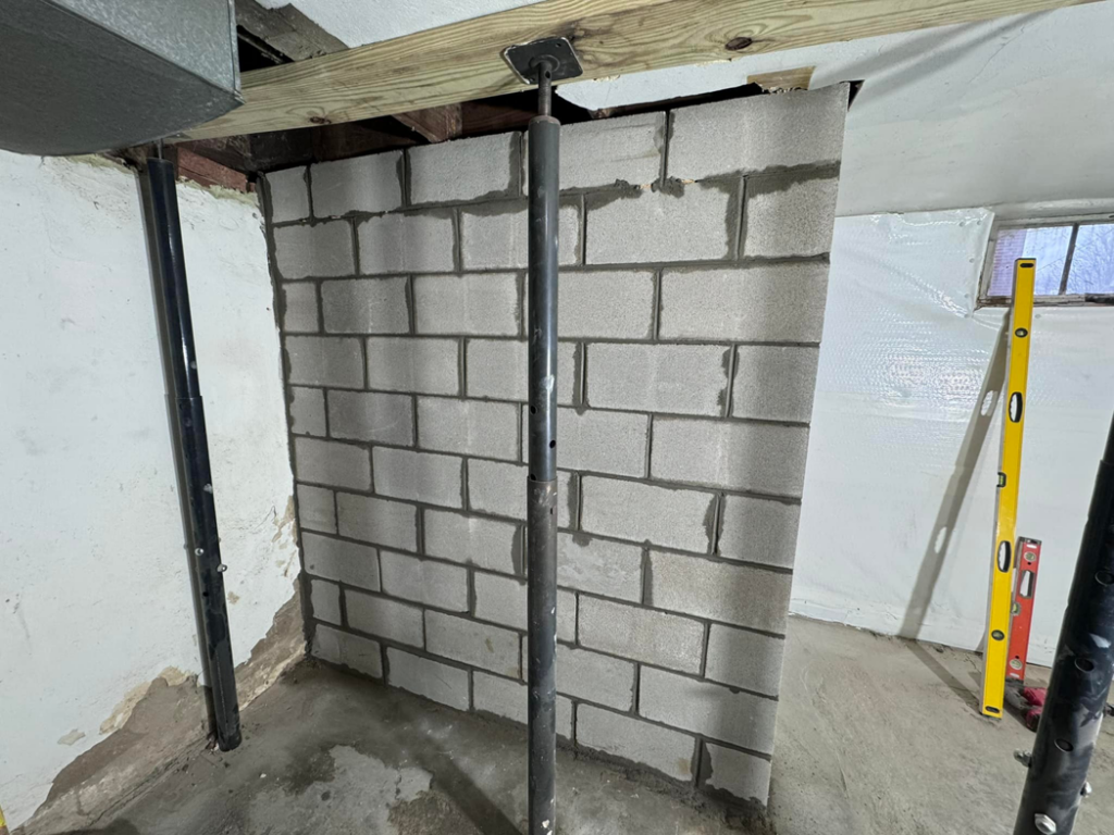 New cinder block wall construction in a basement by Home Pros WV in Charleston, WV.