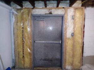 Basement door framing and insulation work by Vermont Professional Solutions LLC in South Burlington, VT.