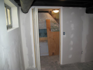 Basement room with newly installed drywall and framing during a finishing project by Kingdom Advance Construction in Louisville, KY