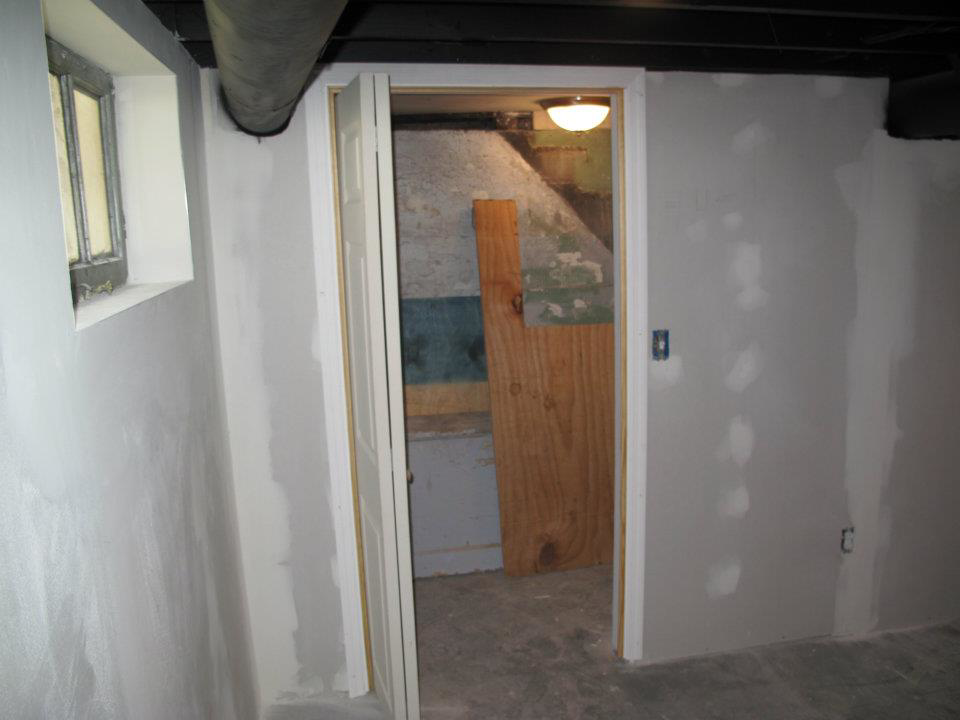 Basement room with newly installed drywall and framing during a finishing project by Kingdom Advance Construction in Louisville, KY
