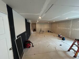 Basement drywall installation and finishing in progress by Justin-case Repairs in Ankeny, IA.