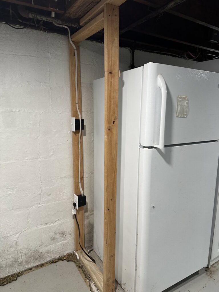 New electrical outlets and wiring rough-in on a framed wall in a basement by King Electric Service, LLC in Pittsburgh, PA