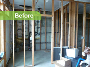 A "Before" view of a basement with wooden framing and insulation, indicating a renovation project by Advanced Seamless Gutters, Inc. in Chicopee, MA.